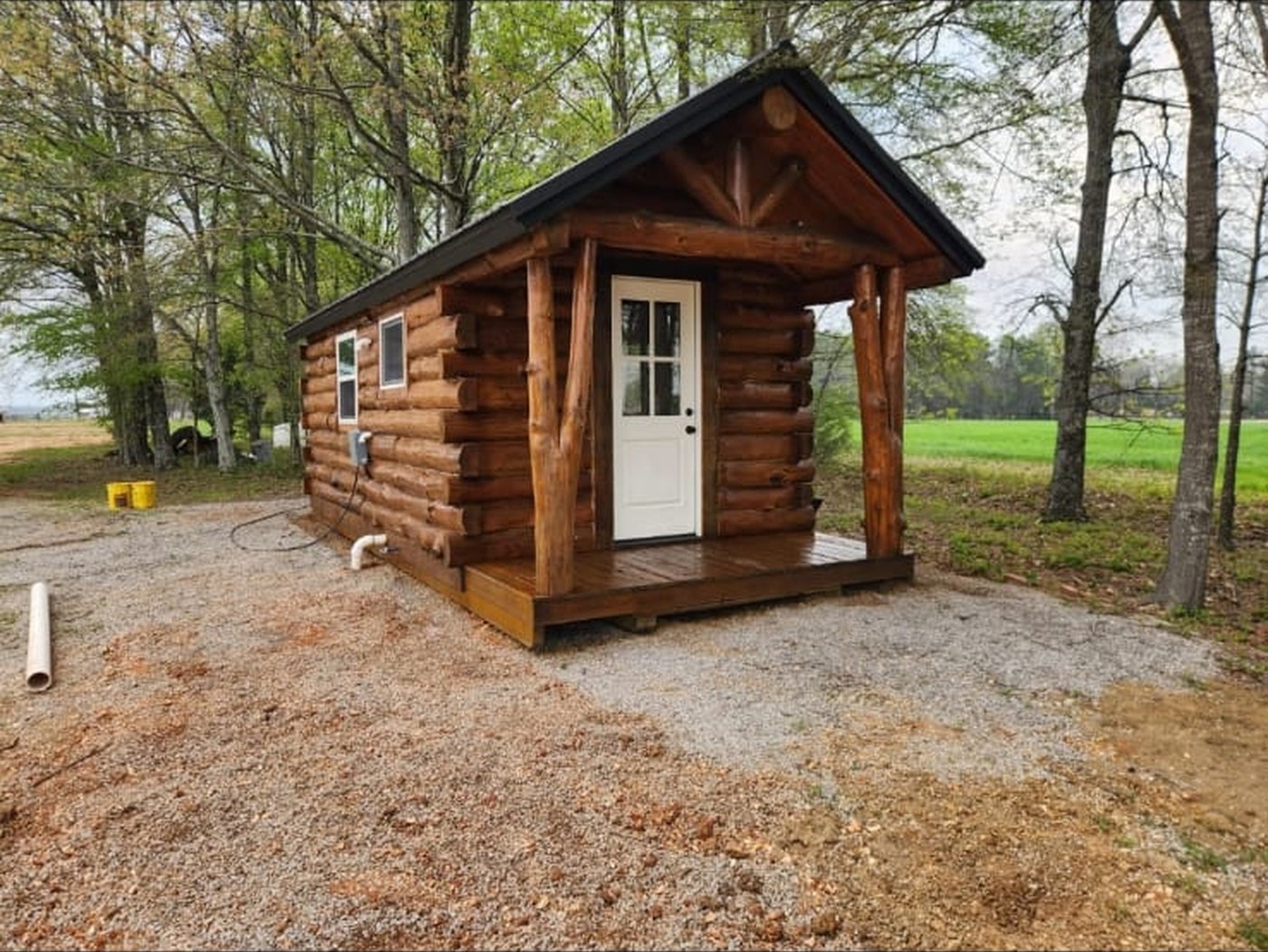 Tiny log cabin with front porch — Timberstone, Mountain Grove MO