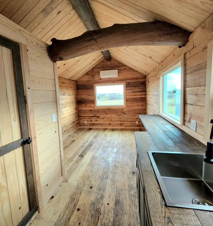 Cabin interior with plank floor and kitchen counter